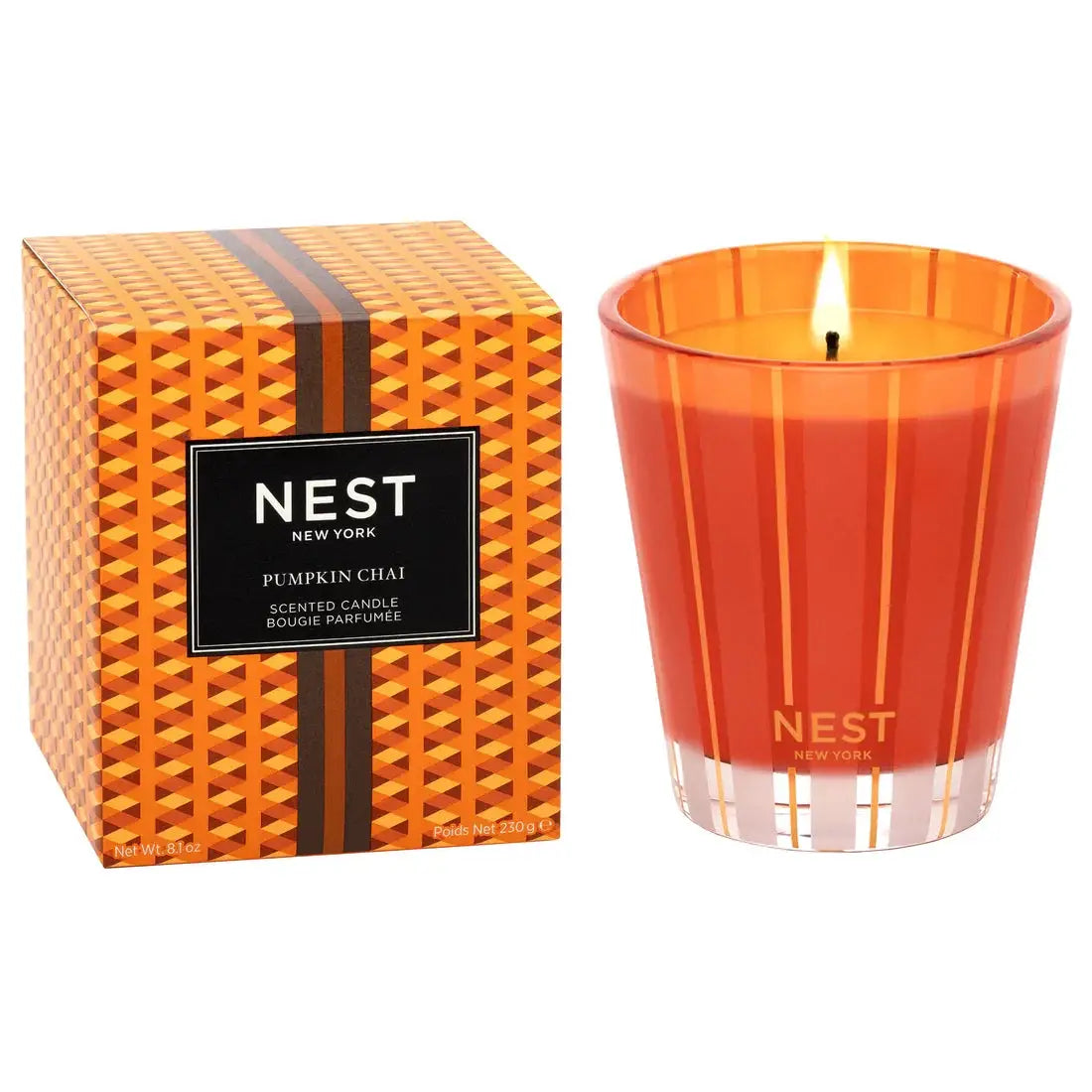 Nest New York Pumpkin Chai Candle in orange striped glass jar with orange patterned box on Tampa Home & Garden Store