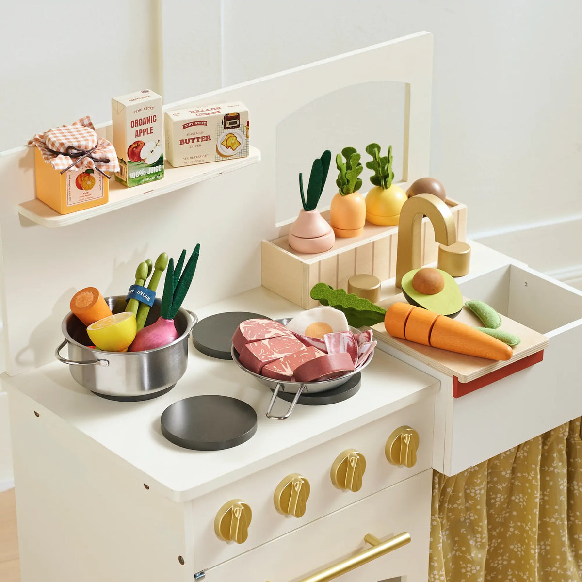 Tiny Land Organic Meat & Seafood Pack play food with sliced meat on a white kitchen counter on Tampa Home & Garden Store