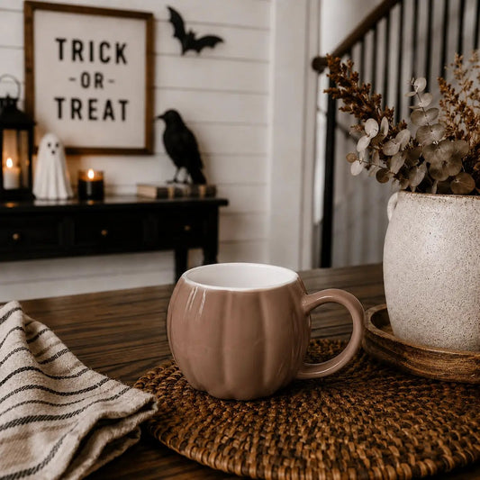 Pumpkin-shaped ceramic coffee mug in blush pink glaze with ribbed panels Gia Roma on Tampa Home & Garden Store