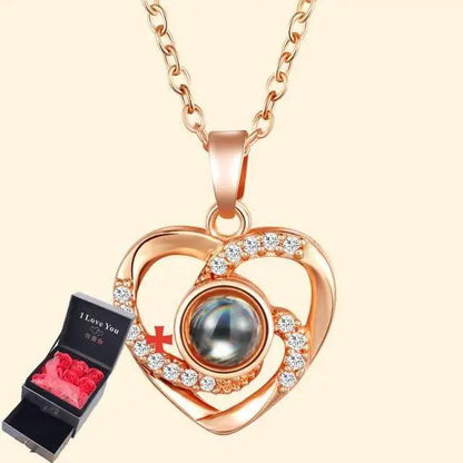 Rose gold heart pendant necklace with diamond frame and stone; gift box with pink roses on Tampa Home & Garden Store