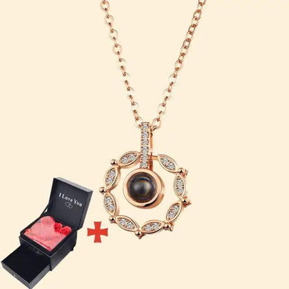 Rose gold pendant necklace with crystal halo and dark central pearl, shown with gift box on Tampa Home & Garden Store