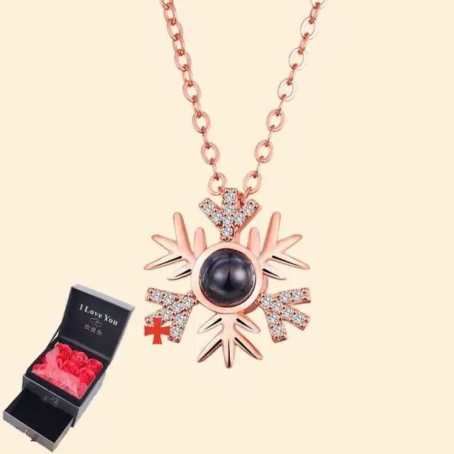 Rose gold snowflake pendant necklace with crystal accents and dark orb center; gift box on Tampa Home & Garden Store