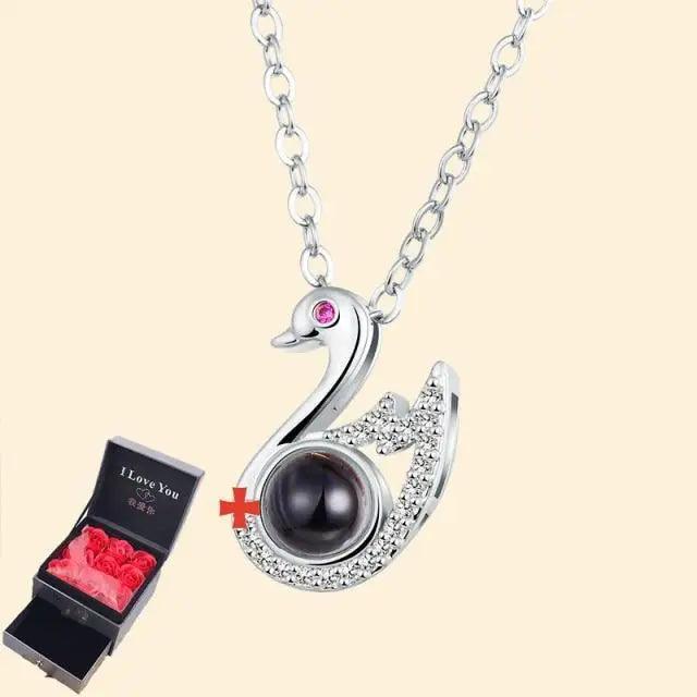 Stevvex silver swan pendant necklace with crystal pavé and black center; pink rose gift box on Tampa Home & Garden Store