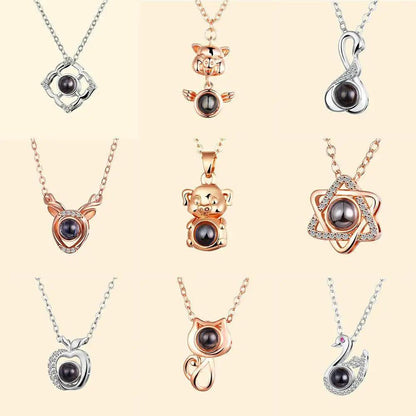 ALU93241RSS nine pendant necklaces with black pearl centers in rose-gold and silver tones on Tampa Home & Garden Store