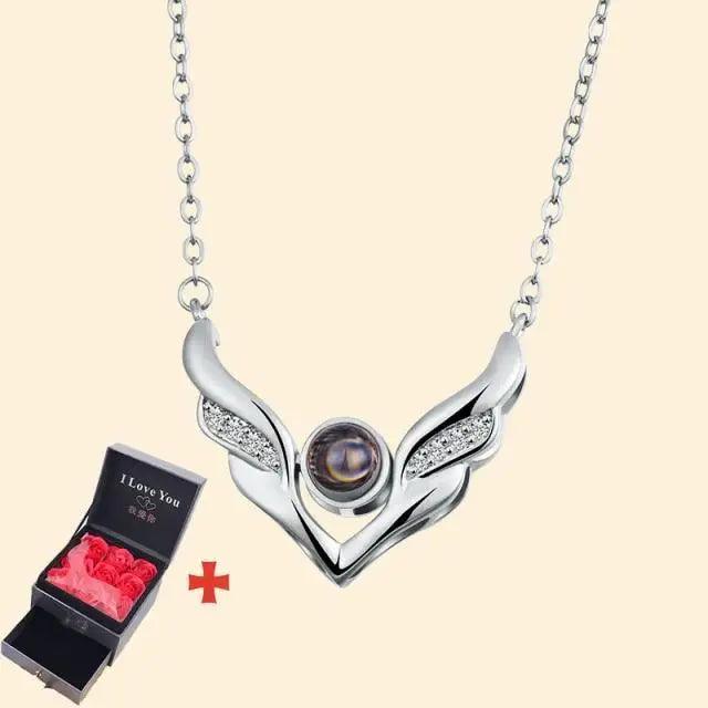 Stevvex winged pendant necklace with silver-tone wings and purple gem; rose gift box on Tampa Home & Garden Store