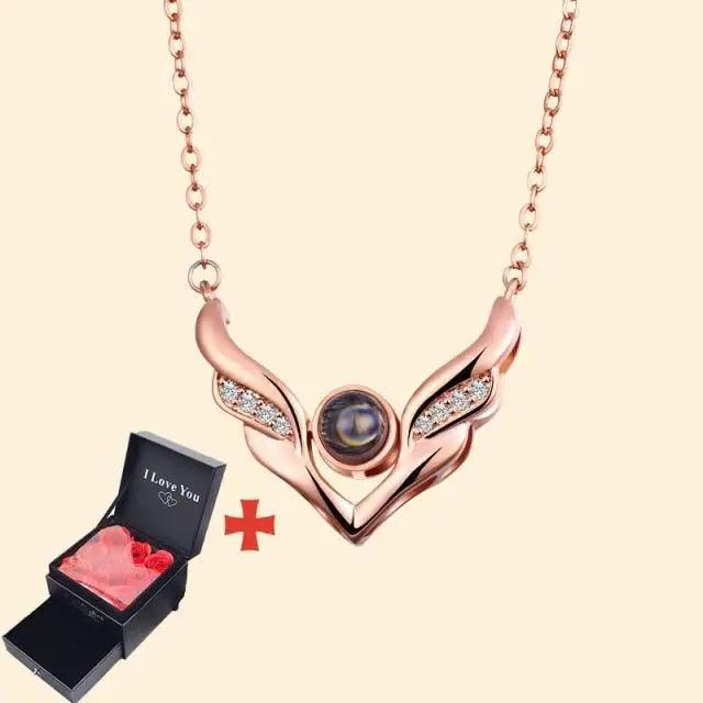 Rose-gold wing necklace with gem on chain beside black gift box Stevvex on Tampa Home & Garden Store