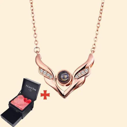 Rose-gold wing necklace with gem on chain beside black gift box Stevvex on Tampa Home & Garden Store