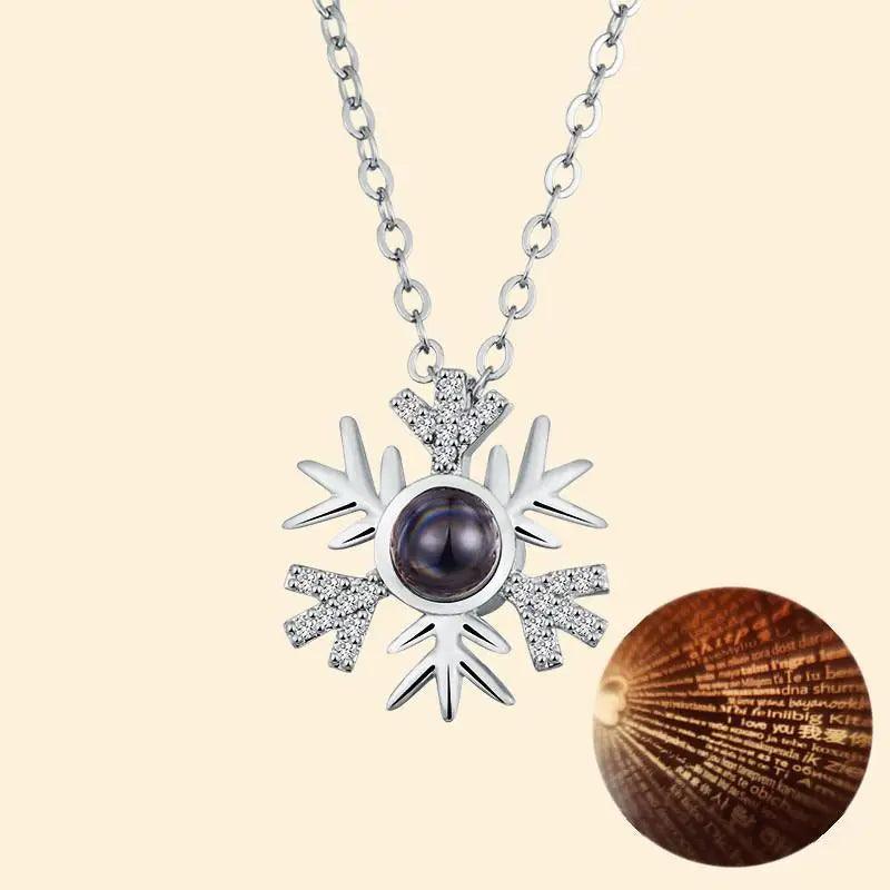 Stevvex silver snowflake pendant necklace with a purple cabochon center and crystal accents on Tampa Home & Garden Store