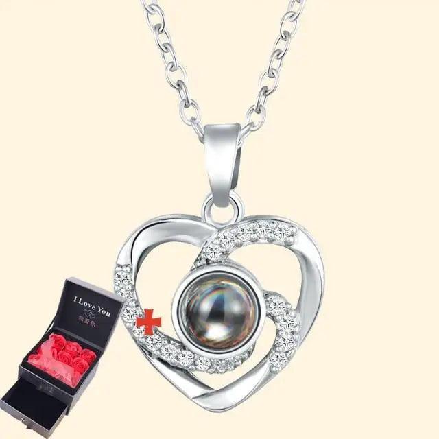 Silver heart pendant necklace with crystals and central pearl; gift box with red roses on Tampa Home & Garden Store