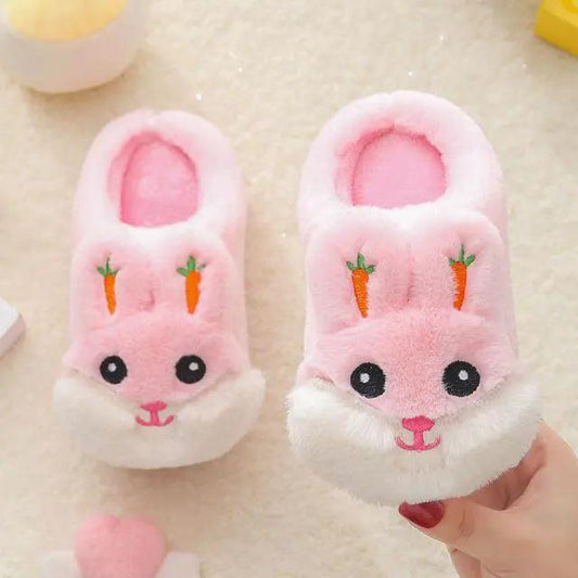 Pair of pink plush bunny slippers for kids with carrot embroidery and white fluffy trim on Tampa Home & Garden Store