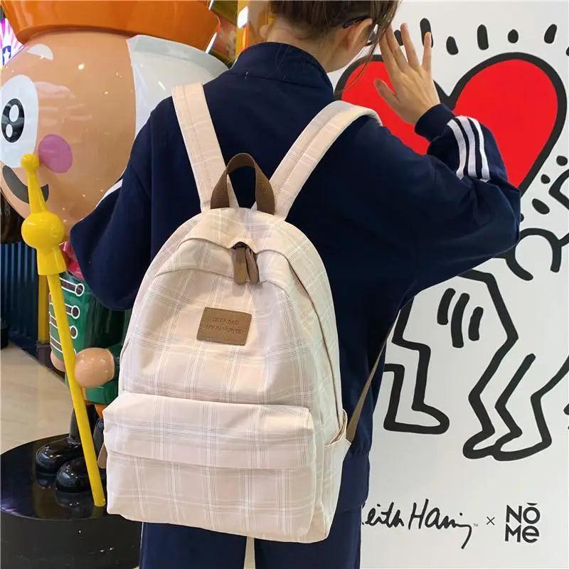 Stevvex beige plaid school backpack for women and teens with front pocket and leather logo patch on Tampa Home & Garden Store