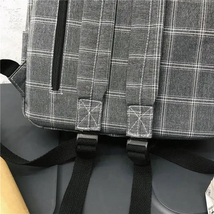 Stevvex gray plaid school backpack with black straps and zip pocket on Tampa Home & Garden Store