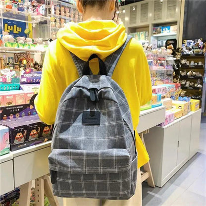 Stevvex gray plaid school backpack with front pocket and black straps on Tampa Home & Garden Store