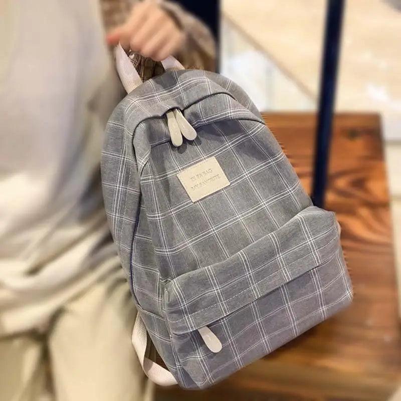 Stevvex gray plaid school backpack with front pocket and white zipper pulls on Tampa Home & Garden Store
