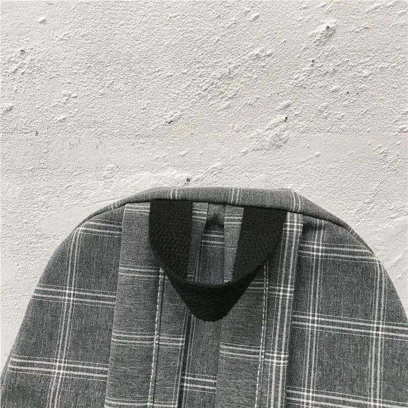 School backpack by Stevvex, gray plaid fabric with a black loop handle on Tampa Home & Garden Store