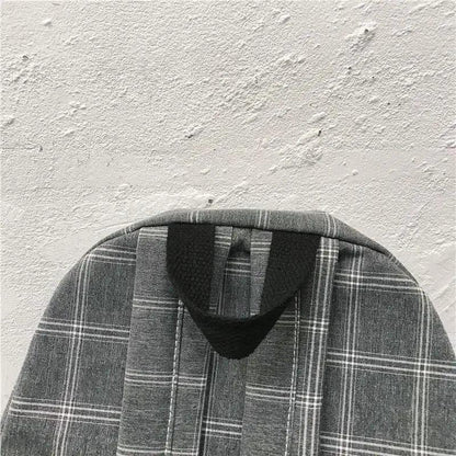 School backpack by Stevvex, gray plaid fabric with a black loop handle on Tampa Home & Garden Store