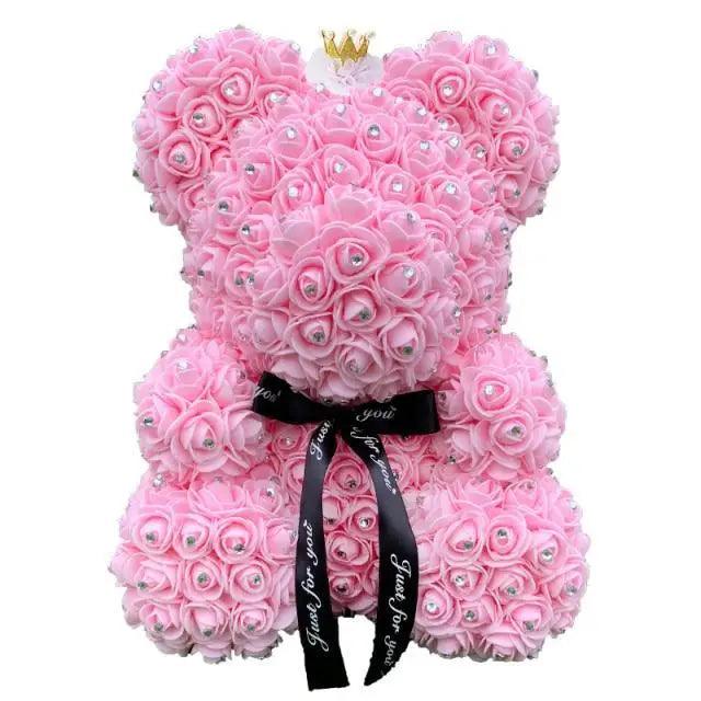 Pink rose teddy bear made of artificial blossoms with rhinestone centers crown and black ribbon on Tampa Home & Garden Store