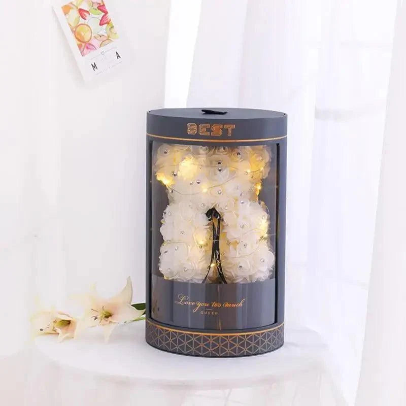 Stevvex Diamond Rose Bear 40cm artificial flower teddy in a display cylinder with warm lights on Tampa Home & Garden Store