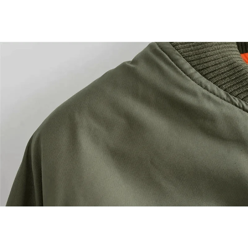 Green Stevvex bomber jacket close-up fabric texture with ribbed collar on Tampa Home & Garden Store