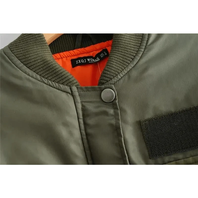 Green women's bomber jacket with orange lining, ribbed collar and zip front on Tampa Home & Garden Store
