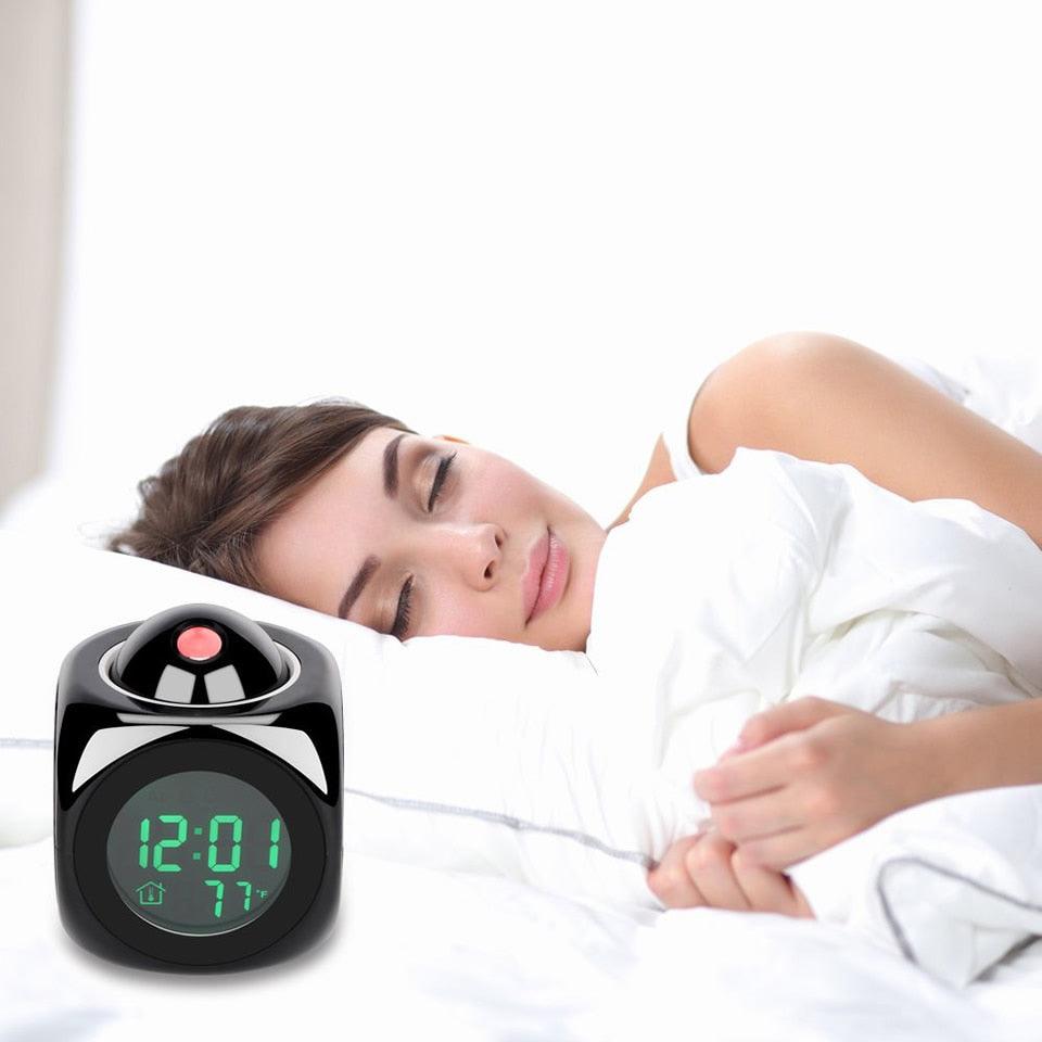 Stevvex STCC895GVH alarm clock with green LED time display and red projector beside sleeper on Tampa Home & Garden Store