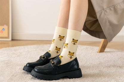 Cream cotton dog-face crew socks with Pomeranian prints, worn with black loafers on Tampa Home & Garden Store