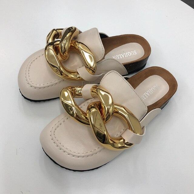 Beige Stevvex closed-toe mule sandals with a chunky gold chain across the vamp on Tampa Home & Garden Store