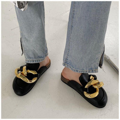 Pair of Stevvex black slip-on sandals with large gold chain detail on Tampa Home & Garden Store