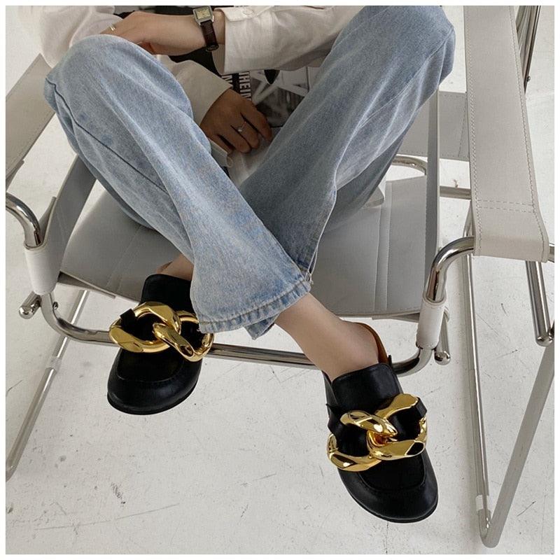 Black slip-on mule sandals with oversized gold chain detail, round toe on Tampa Home & Garden Store