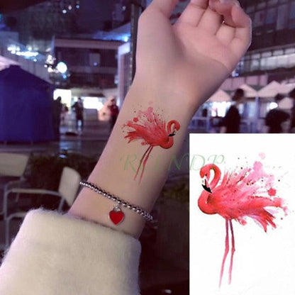 Stevvex temporary tattoo pink flamingo on forearm watercolor finish with red bracelet on Tampa Home & Garden Store