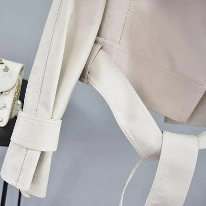 Stevvex cream PU leather motorcycle jacket with waist belt and cuff strap detail, close-up on Tampa Home & Garden Store