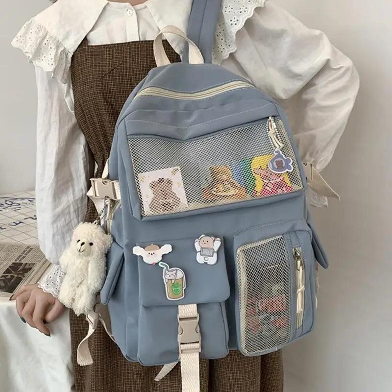 New Elegant Waterproof Backpack for ladies Stevvex blue school backpack with mesh front pocket and cute patches on Tampa Home & Garden Store