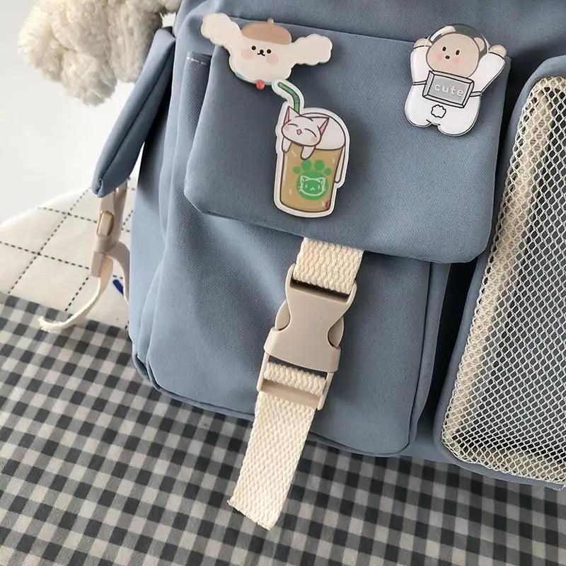 Stevvex waterproof blue backpack with beige strap and cute charms on Tampa Home & Garden Store