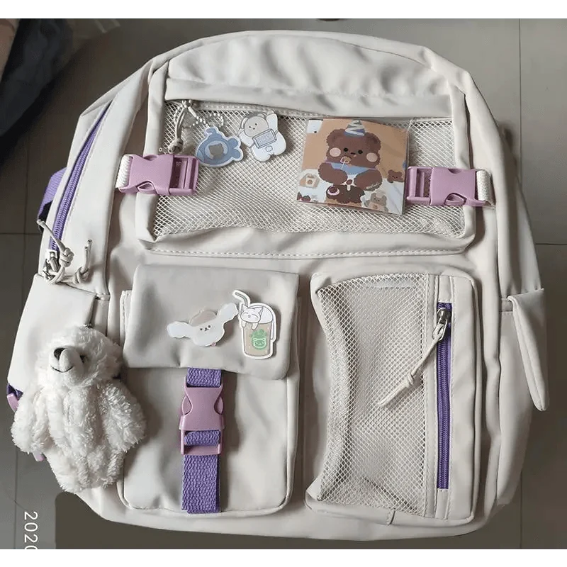 Stevvex beige waterproof backpack with lilac straps, mesh pockets and bear charm for teens on Tampa Home & Garden Store