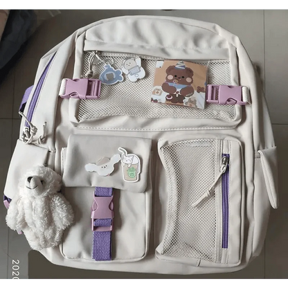 Stevvex beige waterproof backpack with lilac straps, mesh pockets and bear charm for teens on Tampa Home & Garden Store