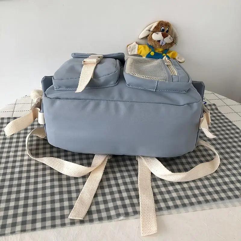 Stevvex light-blue waterproof school backpack with beige straps and mesh pocket, plush bunny on Tampa Home & Garden Store