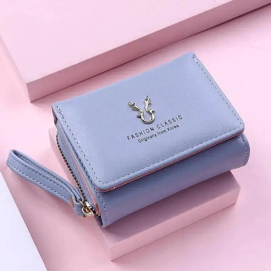 Stevvex ALU92996LMN light blue wallet with zipper closure and wrist strap, front deer logo on Tampa Home & Garden Store