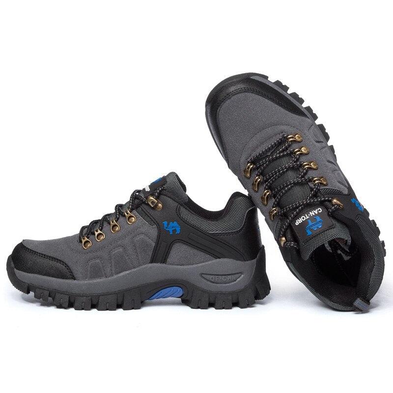 Stevvex men's hiking boots pair gray/black with lug outsole, metal eyelets and blue logo on Tampa Home & Garden Store