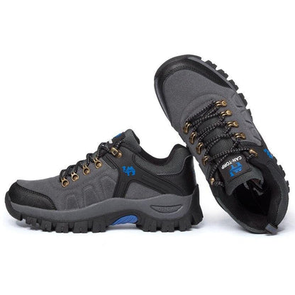 Stevvex men's hiking boots pair gray/black with lug outsole, metal eyelets and blue logo on Tampa Home & Garden Store