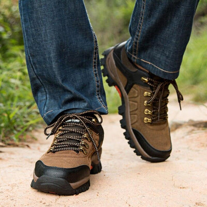 Stevvex men's brown waterproof hiking boots with rugged outsole on dirt trail on Tampa Home & Garden Store