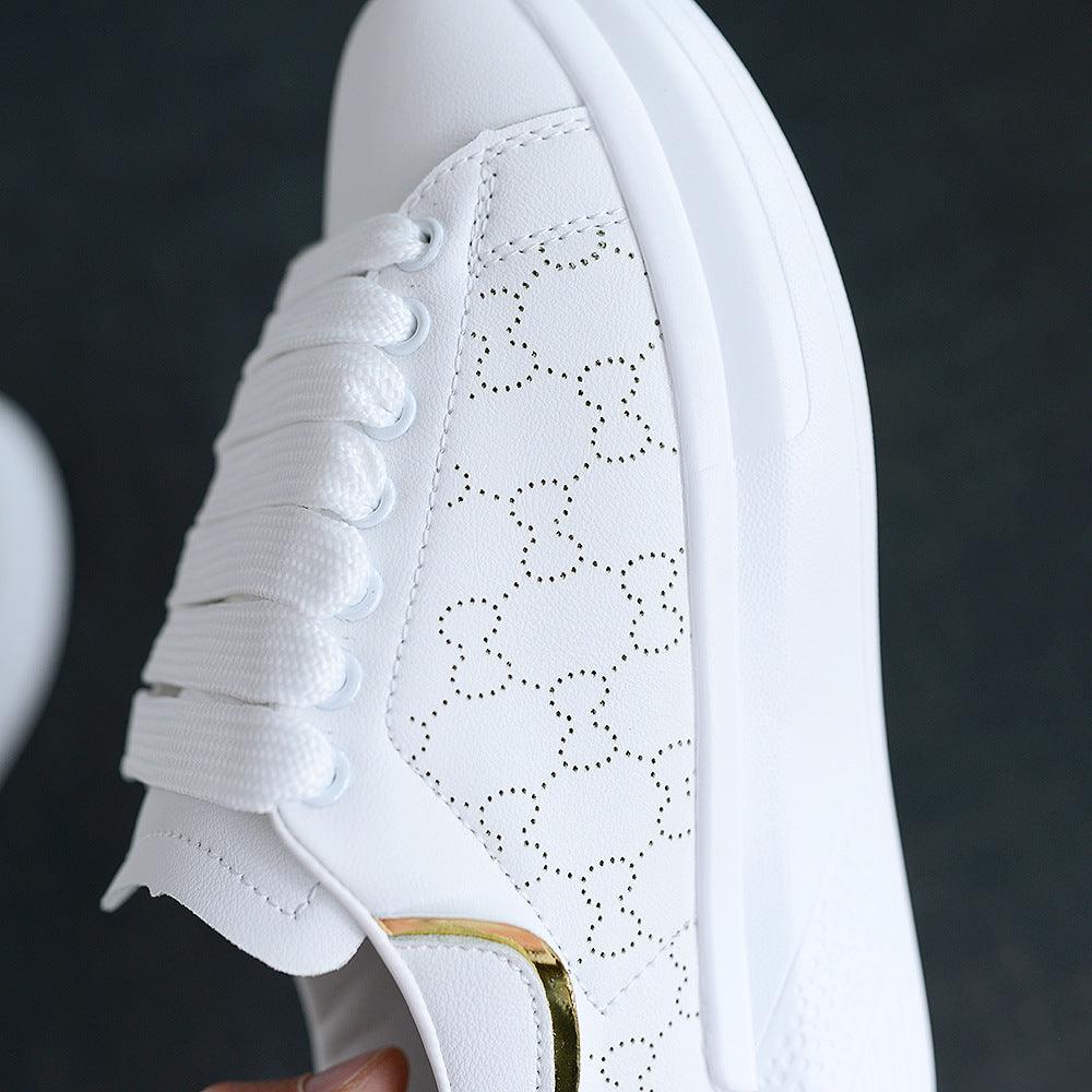 Stevvex white sneakers with circular perforation pattern and gold heel accent on Tampa Home & Garden Store
