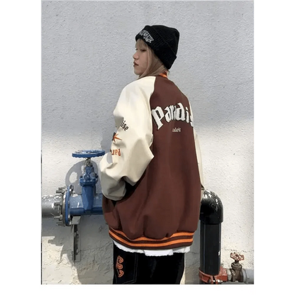 Stevvex varsity jacket color-block brown cream with orange rib cuffs worn by model on Tampa Home & Garden Store