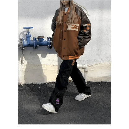 Stevvex varsity jacket brown body, black sleeves, patchwork bone embroidery, unisex streetwear on Tampa Home & Garden Store