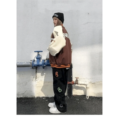 Stevvex varsity jacket color-block furry bone patchwork brown body cream sleeves orange trim on Tampa Home & Garden Store