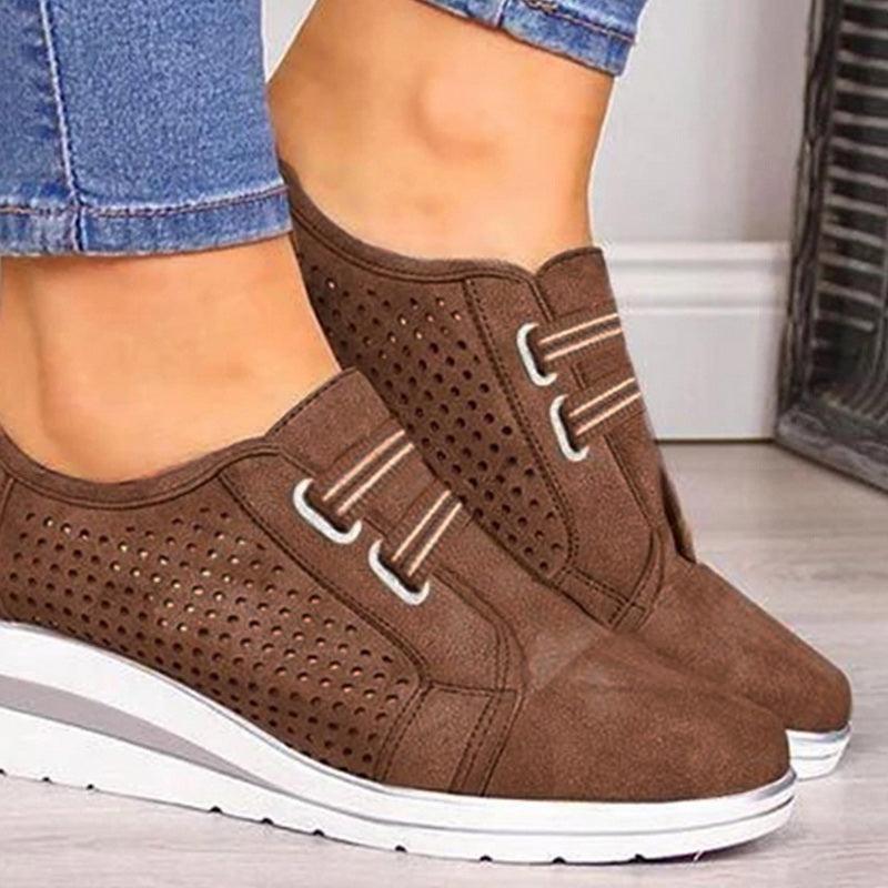 Brown perforated suede sneakers with white platform sole and lace-up front, pair on Tampa Home & Garden Store