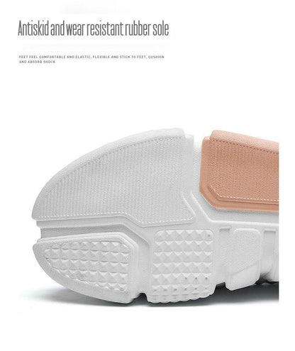 Athletic shoes sole close-up in white with textured grip and tan strap on Tampa Home & Garden Store