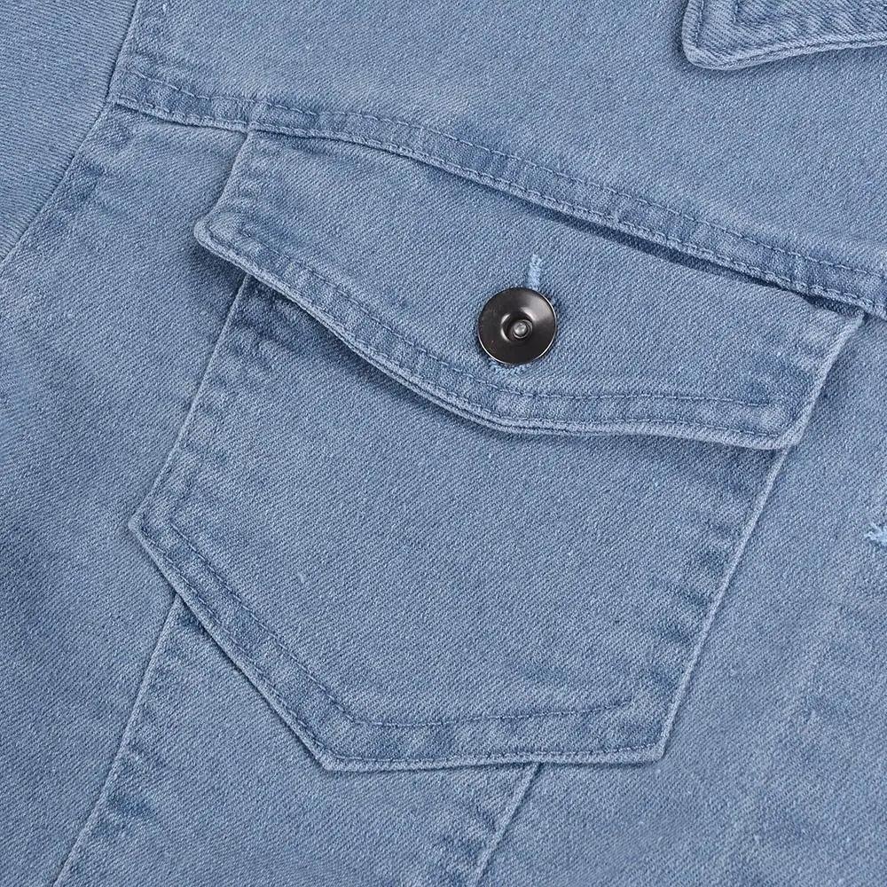 Light blue denim trucker jacket pocket with flap and black button on Tampa Home & Garden Store
