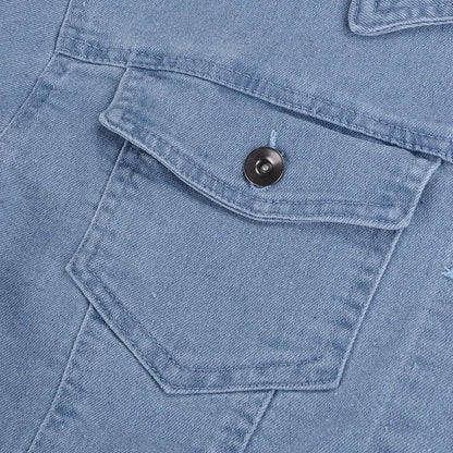 Light blue denim trucker jacket pocket with flap and black button on Tampa Home & Garden Store