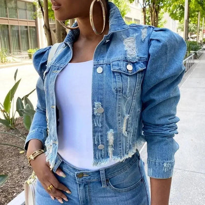 Cropped blue distressed denim jacket with puff sleeves and silver hardware over white tank on Tampa Home & Garden Store