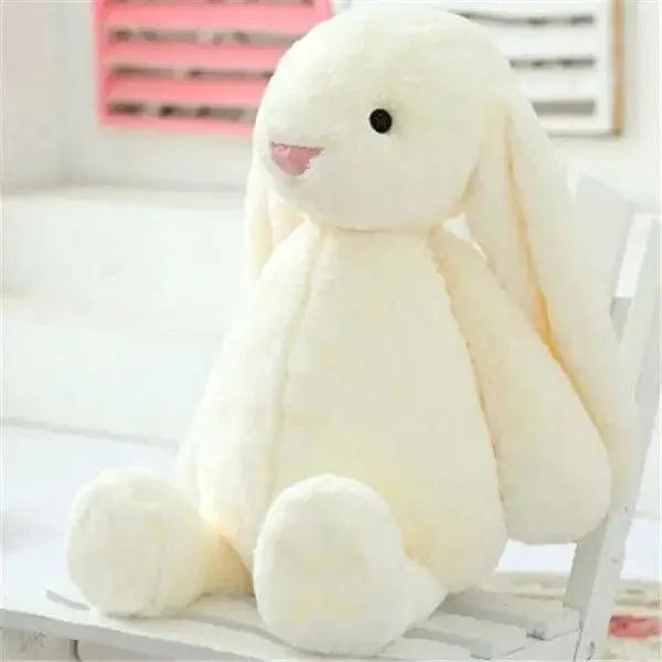 Cream plush bunny stuffed toy for babies, soft cuddly rabbit with long ears on a white chair on Tampa Home & Garden Store
